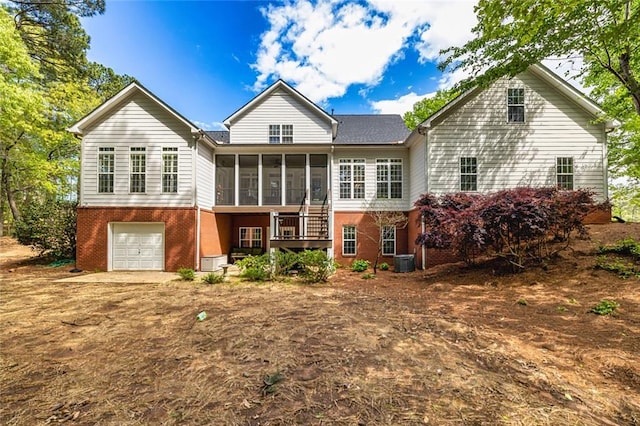 20 Jasmine Ct, Newnan, GA 30265 - rear view of property with a sunroom, brick siding, and an attached garage