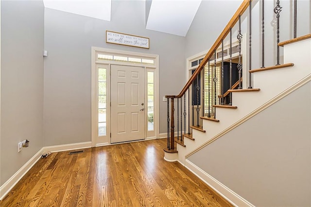 20 Jasmine Ct, Newnan, GA 30265 - entryway featuring wood finished floors, stairs, and high vaulted ceiling