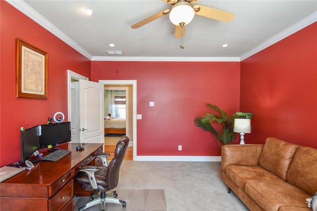 office featuring light carpet, a ceiling fan, baseboards, visible vents, and crown molding