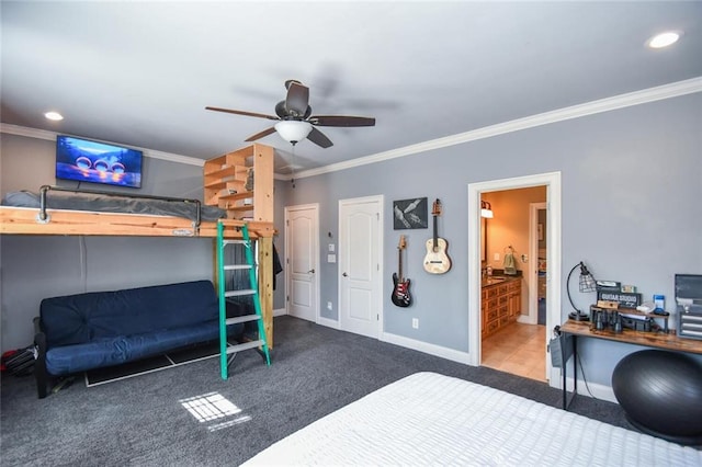 carpeted bedroom featuring baseboards, ornamental molding, ensuite bathroom, and recessed lighting