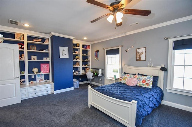 carpeted bedroom featuring baseboards, visible vents, ceiling fan, and ornamental molding