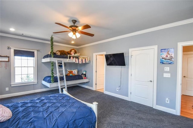 carpeted bedroom with ornamental molding, visible vents, baseboards, and a ceiling fan