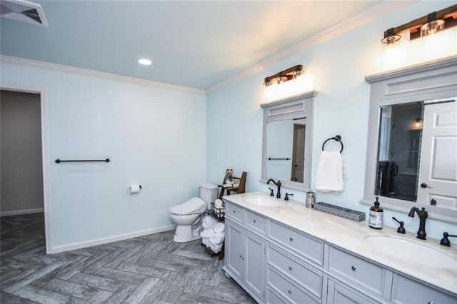 bathroom featuring baseboards, visible vents, toilet, ornamental molding, and a sink