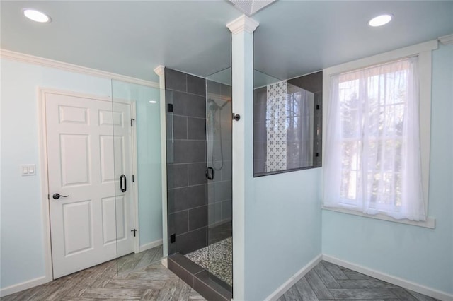 full bathroom with a stall shower, plenty of natural light, and baseboards