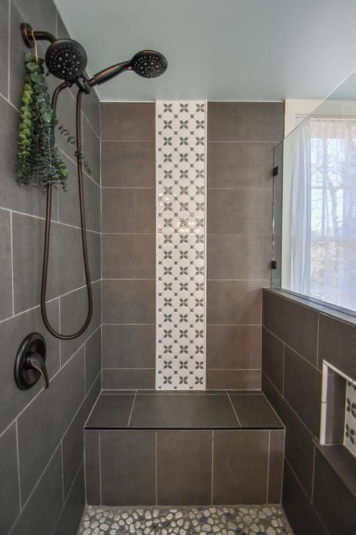 bathroom with a tile shower