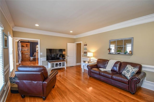 living room with crown molding, wood finished floors, and recessed lighting