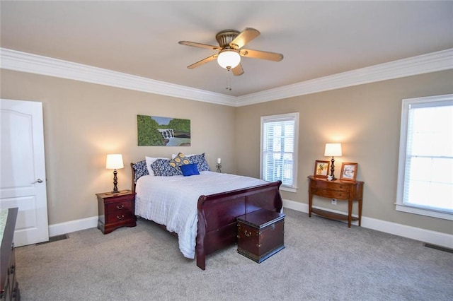 bedroom with carpet, visible vents, baseboards, and crown molding