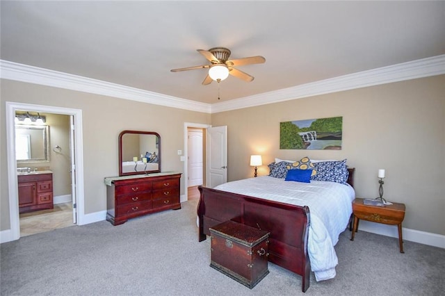 bedroom featuring baseboards, a ceiling fan, ensuite bath, ornamental molding, and carpet