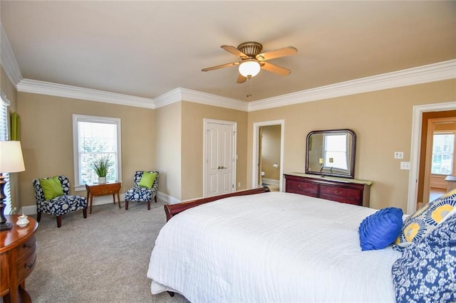 bedroom featuring carpet floors, baseboards, ornamental molding, and a ceiling fan