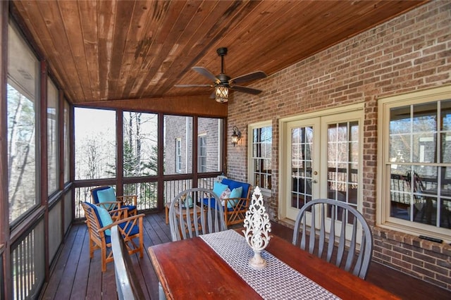 unfurnished sunroom featuring lofted ceiling, ceiling fan, french doors, and wooden ceiling