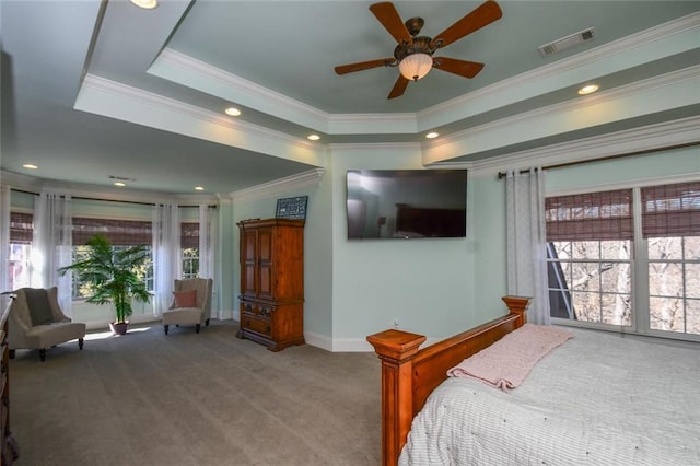 carpeted bedroom with baseboards, visible vents, a raised ceiling, and recessed lighting