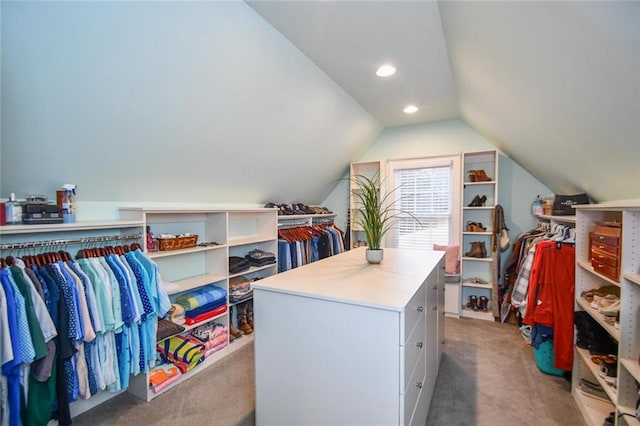 spacious closet featuring light carpet and lofted ceiling