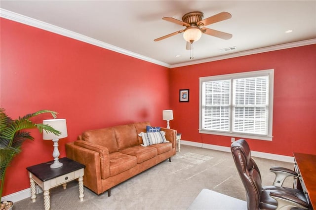 carpeted home office featuring visible vents, ornamental molding, a ceiling fan, and baseboards