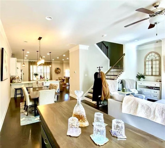 dining space featuring ornamental molding, dark hardwood / wood-style floors, and ceiling fan