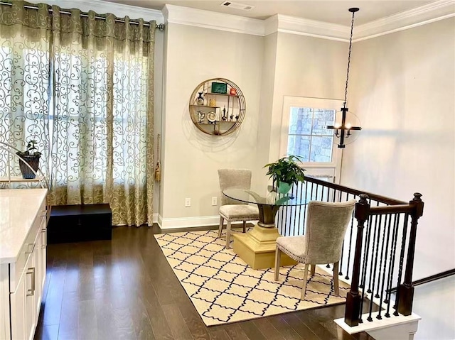 living area featuring crown molding and dark hardwood / wood-style floors