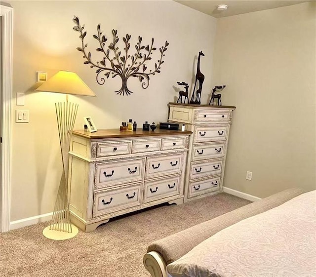 bedroom with light colored carpet