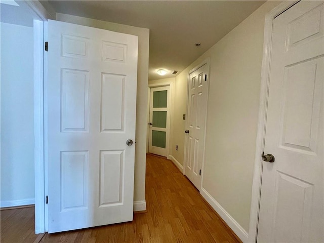 199 14th St NE Unit 710, Atlanta, GA 30309 - corridor featuring wood finished floors and baseboards