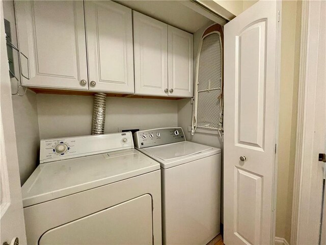 199 14th St NE Unit 710, Atlanta, GA 30309 - washroom with washing machine and clothes dryer and cabinet space