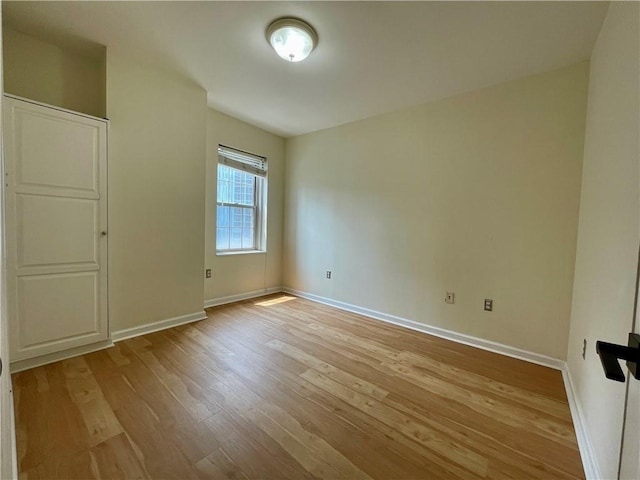 199 14th St NE Unit 710, Atlanta, GA 30309 - unfurnished bedroom featuring light wood-style flooring and baseboards