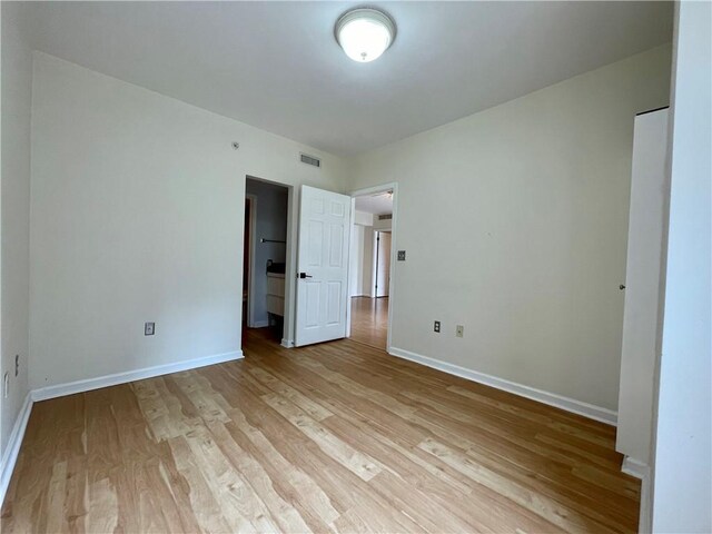 199 14th St NE Unit 710, Atlanta, GA 30309 - unfurnished bedroom featuring light wood finished floors and baseboards