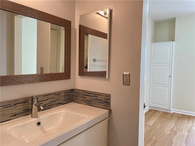 199 14th St NE Unit 710, Atlanta, GA 30309 - bathroom featuring wood finished floors and vanity