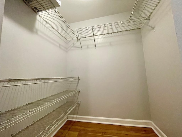199 14th St NE Unit 710, Atlanta, GA 30309 - walk in closet featuring wood finished floors