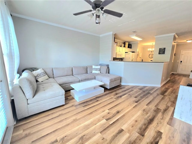1975 Nocturne Dr Unit 2206, Alpharetta, GA 30009 - living room with ornamental molding, wood finished floors, a chandelier, and a ceiling fan