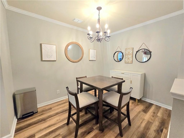 1975 Nocturne Dr Unit 2206, Alpharetta, GA 30009 - dining area with a chandelier, wood finished floors, and crown molding