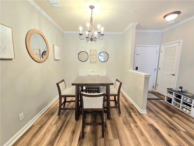 1975 Nocturne Dr Unit 2206, Alpharetta, GA 30009 - dining room with wood finished floors, ornamental molding, and a chandelier