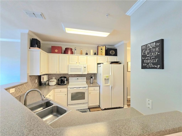 1975 Nocturne Dr Unit 2206, Alpharetta, GA 30009 - kitchen featuring white appliances, crown molding, tasteful backsplash, white cabinets, and a peninsula