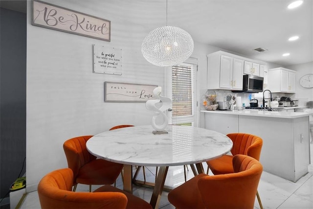 dining space with recessed lighting, visible vents, and marble finish floor