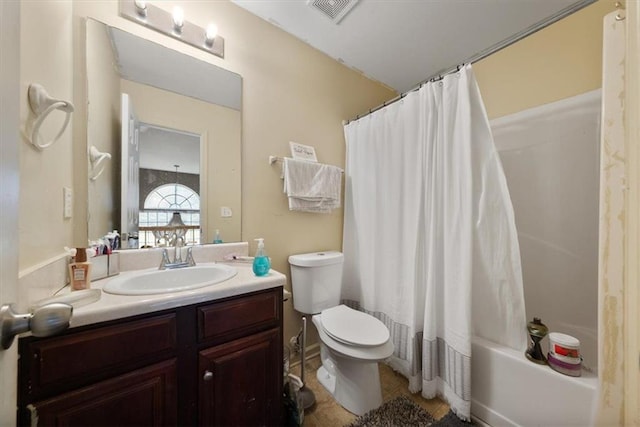 bathroom with vanity, shower / bathtub combination with curtain, visible vents, tile patterned flooring, and toilet