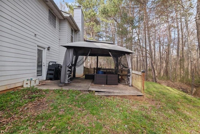 view of yard featuring a gazebo and a deck