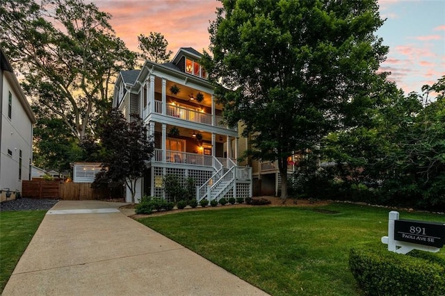 891 Paoli Ave SE, Atlanta, GA 30316 - view of front facade featuring stairs, a porch, a balcony, ceiling fan, and driveway