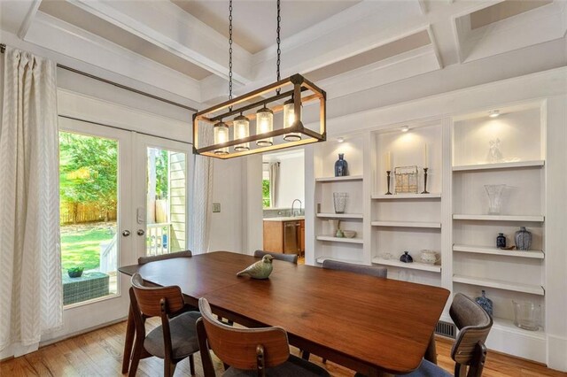 891 Paoli Ave SE, Atlanta, GA 30316 - dining room featuring light wood-type flooring, french doors, coffered ceiling, plenty of natural light, and beamed ceiling