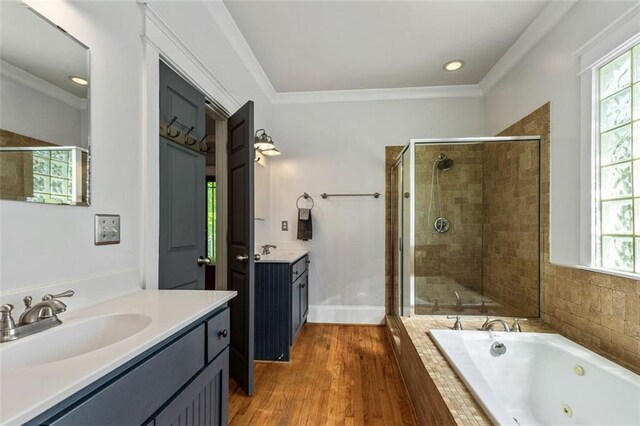 891 Paoli Ave SE, Atlanta, GA 30316 - bathroom with a shower stall, a jetted tub, two vanities, plenty of natural light, and crown molding