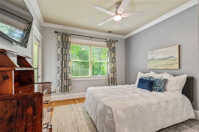 891 Paoli Ave SE, Atlanta, GA 30316 - bedroom featuring wood finished floors, crown molding, and baseboards