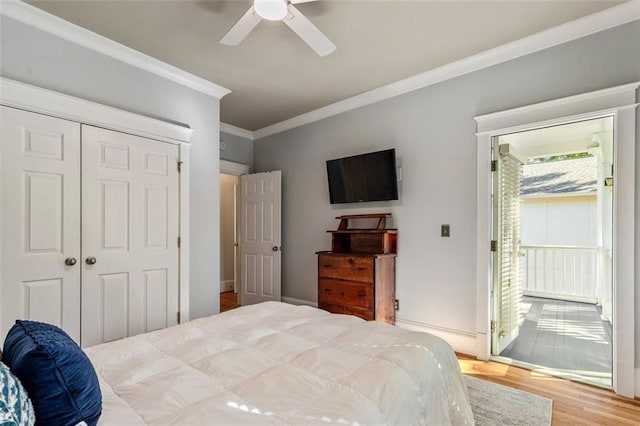 891 Paoli Ave SE, Atlanta, GA 30316 - bedroom featuring ornamental molding, wood finished floors, a closet, a ceiling fan, and a baseboard radiator