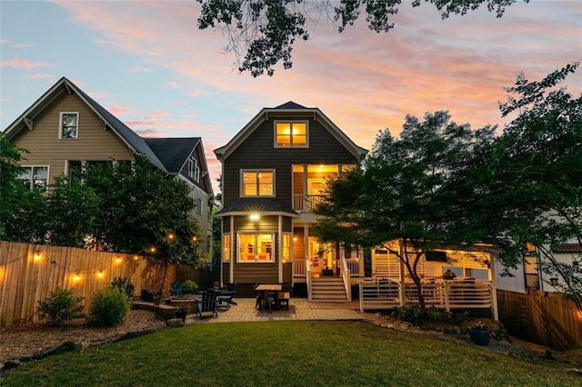 891 Paoli Ave SE, Atlanta, GA 30316 - back of property at dusk featuring a patio area and a deck