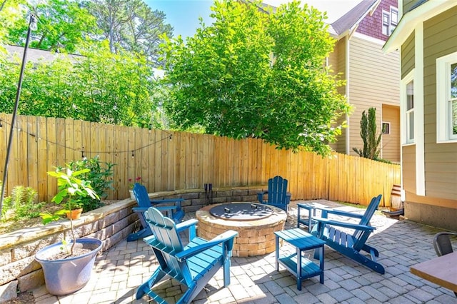 891 Paoli Ave SE, Atlanta, GA 30316 - fenced backyard featuring a fire pit and a patio