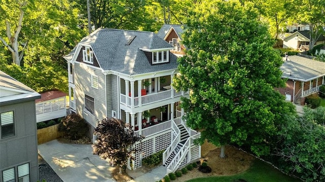 891 Paoli Ave SE, Atlanta, GA 30316 - view of front of house featuring a balcony, covered porch, stairway, and a shingled roof