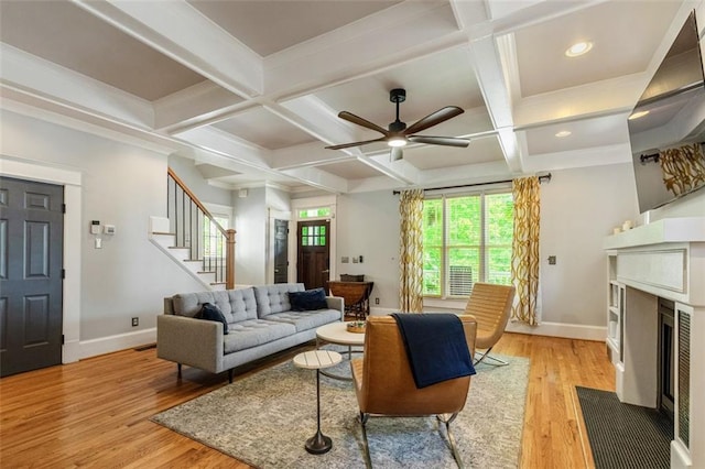 891 Paoli Ave SE, Atlanta, GA 30316 - living area with baseboards, coffered ceiling, a ceiling fan, a fireplace with flush hearth, and light wood-style floors