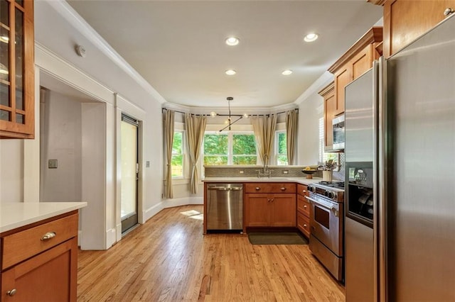 891 Paoli Ave SE, Atlanta, GA 30316 - kitchen with appliances with stainless steel finishes, a peninsula, light wood-type flooring, light countertops, and recessed lighting