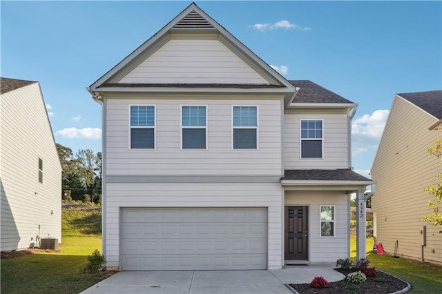 view of front facade with a front lawn and a garage