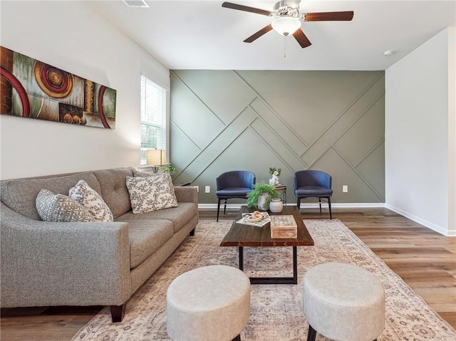 living room with hardwood / wood-style flooring and ceiling fan