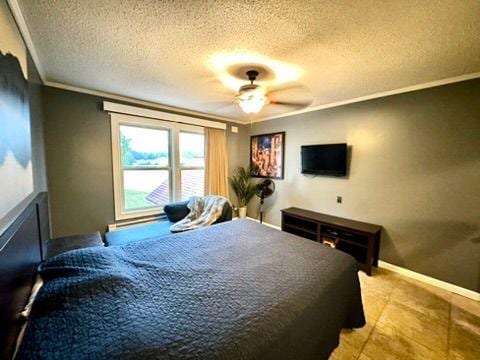 bedroom featuring crown molding and a textured ceiling