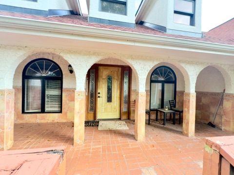 property entrance with a patio and covered porch