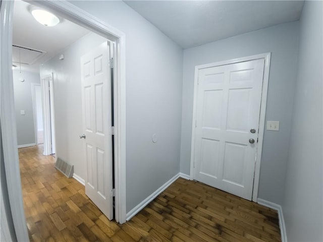 hallway featuring dark hardwood / wood-style floors