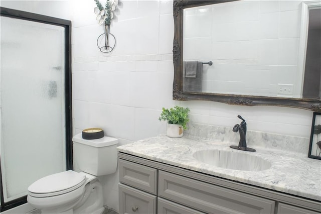 bathroom featuring walk in shower, vanity, and toilet