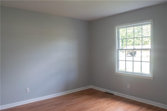 spare room with light wood-type flooring